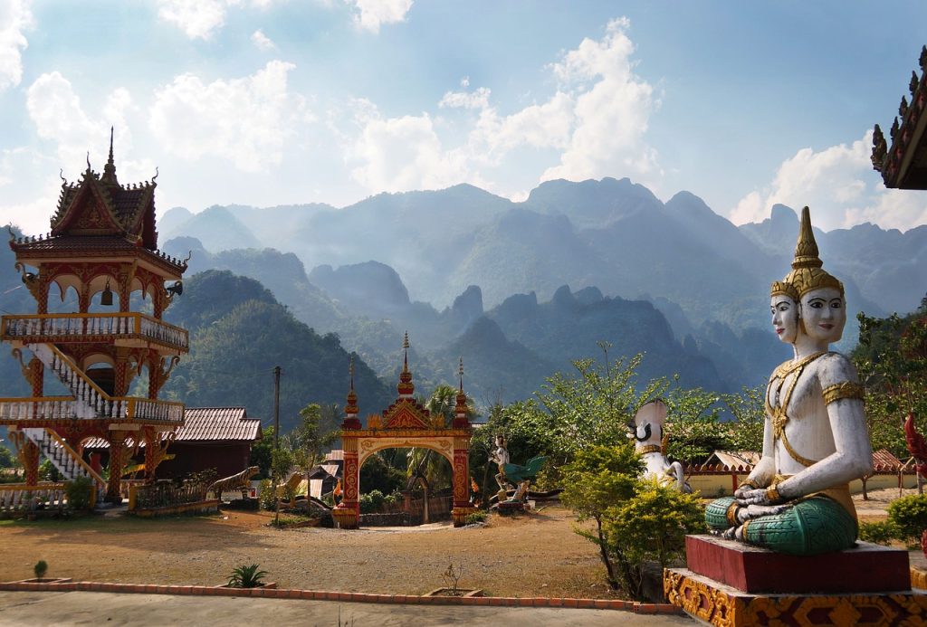 Photo by igormattio laos, temple, mountains