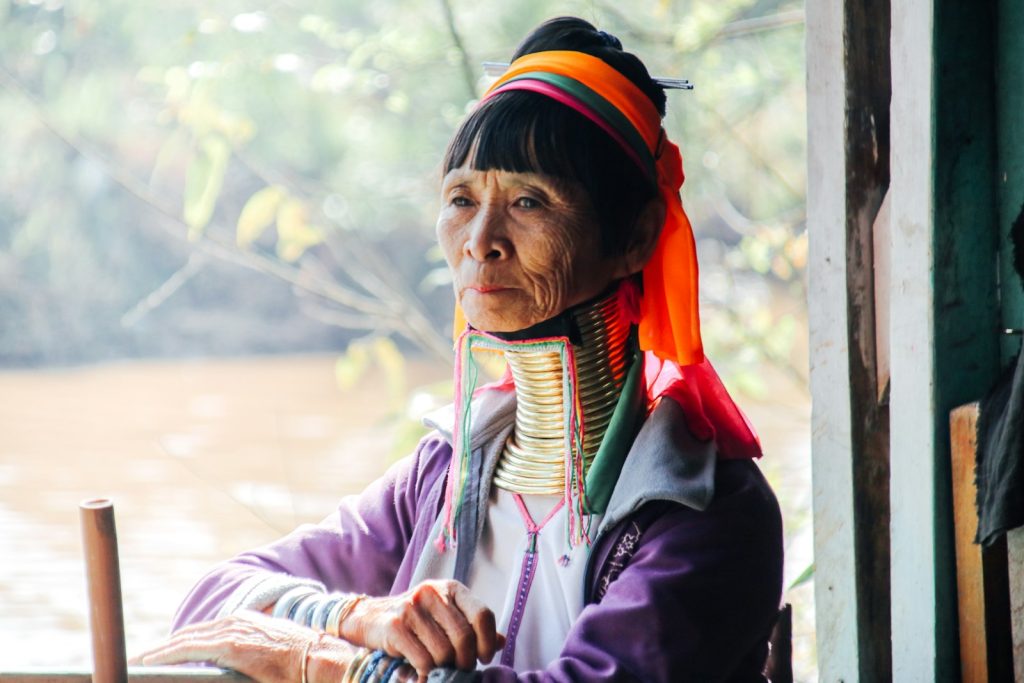 Photo by Thien Kim Nguyen Trinh woman in black jacket wearing red white and blue scarf