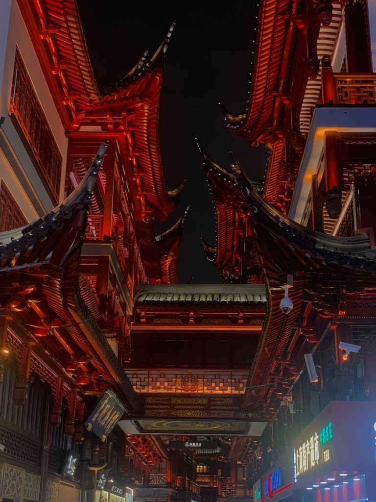 Photo by 2me_ tume a city street filled with lots of tall buildings