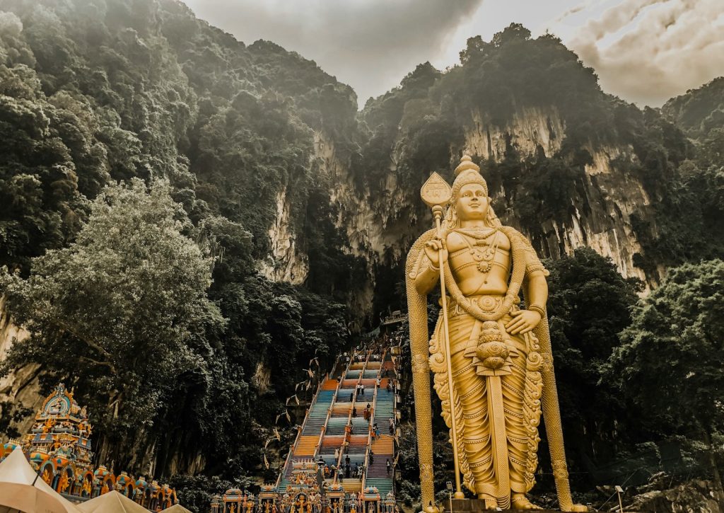 Photo by Meimei Ismail statue near mountain