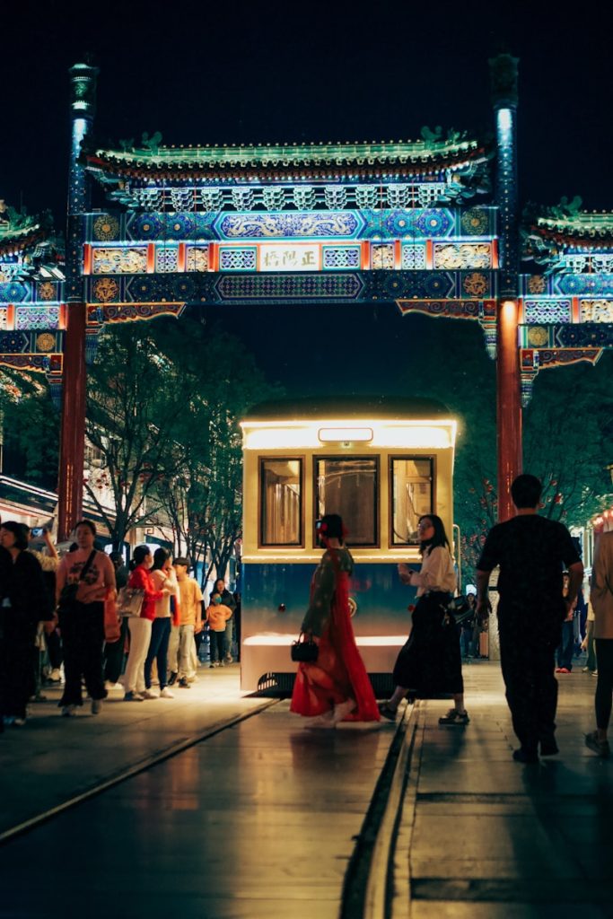 Photo by Christian Lue a group of people standing around a train station
