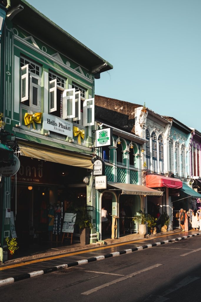 Photo by Alexander Kaufmann a row of buildings on the side of a street