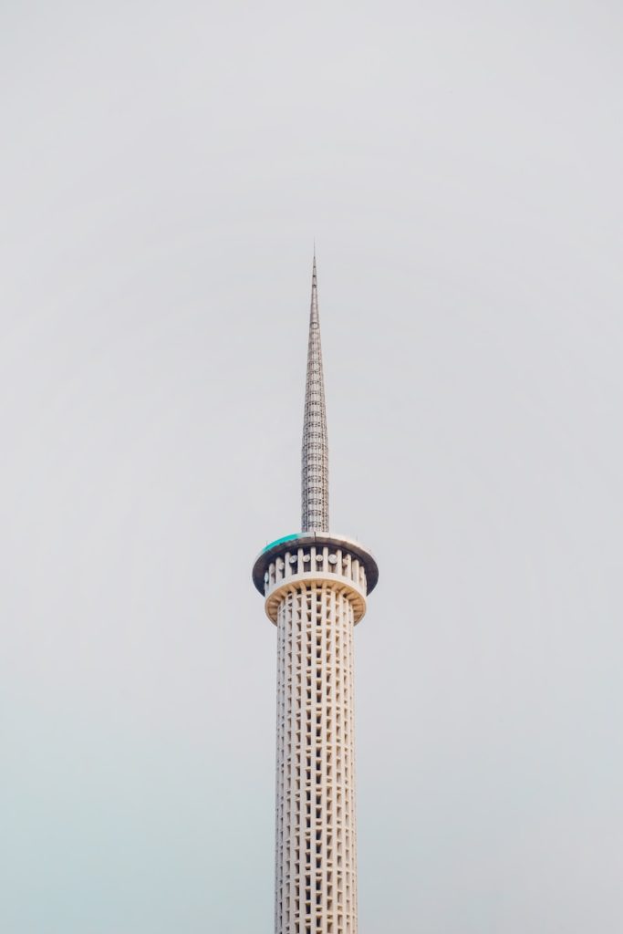 Photo by Mosquegrapher white and brown concrete tower under white sky