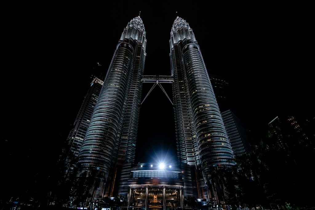 Photo by Kevin Olson lighted Petronas Towers, Kuala Lumpur, Malaysia at night