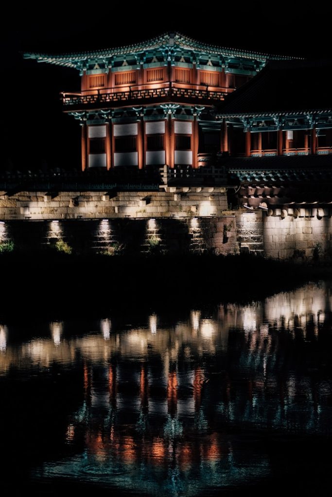 Photo by insung yoon a building that is lit up in the dark
